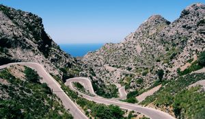 Preview wallpaper mountain, road, winding, grass, beautiful landscape