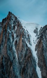 Preview wallpaper mountain, rock, cliff, peak, snow