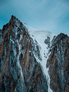 Preview wallpaper mountain, rock, cliff, peak, snow