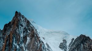Preview wallpaper mountain, rock, cliff, peak, snow
