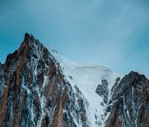 Preview wallpaper mountain, rock, cliff, peak, snow