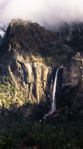 Preview wallpaper mountain, rock, cliff, waterfall, trees, landscape