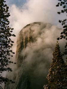 Preview wallpaper mountain, rock, clouds, trees, nature, landscape