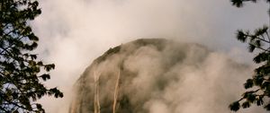 Preview wallpaper mountain, rock, clouds, trees, nature, landscape