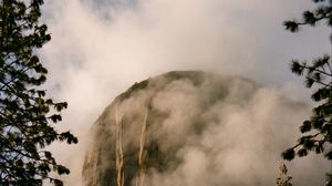 Preview wallpaper mountain, rock, clouds, trees, nature, landscape