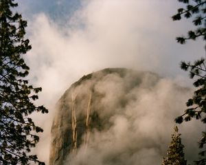 Preview wallpaper mountain, rock, clouds, trees, nature, landscape