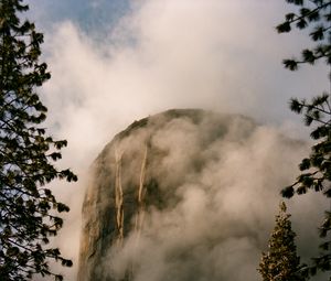 Preview wallpaper mountain, rock, clouds, trees, nature, landscape