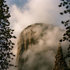 Preview wallpaper mountain, rock, clouds, trees, nature, landscape