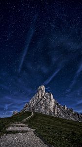 Preview wallpaper mountain, rock, path, night, starry sky