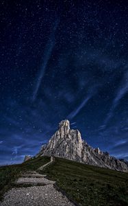 Preview wallpaper mountain, rock, path, night, starry sky