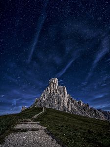 Preview wallpaper mountain, rock, path, night, starry sky
