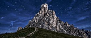 Preview wallpaper mountain, rock, path, night, starry sky