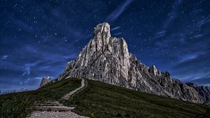 Preview wallpaper mountain, rock, path, night, starry sky