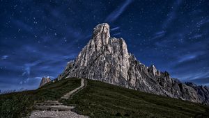 Preview wallpaper mountain, rock, path, night, starry sky