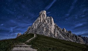 Preview wallpaper mountain, rock, path, night, starry sky