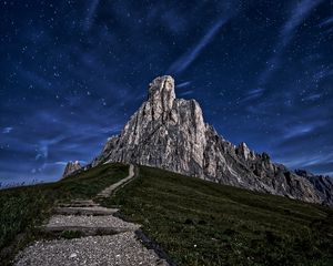Preview wallpaper mountain, rock, path, night, starry sky