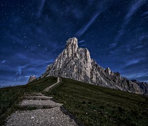 Preview wallpaper mountain, rock, path, night, starry sky