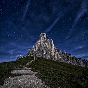 Preview wallpaper mountain, rock, path, night, starry sky