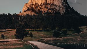 Preview wallpaper mountain, rock, road, trees, landscape