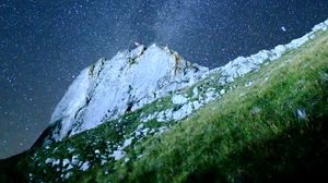 Preview wallpaper mountain, rock, slope, milky way, grass
