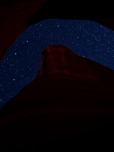 Preview wallpaper mountain, rock, starry sky, night, dark, darkness