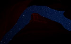 Preview wallpaper mountain, rock, starry sky, night, dark, darkness