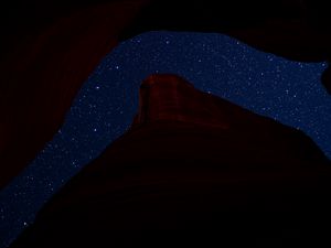 Preview wallpaper mountain, rock, starry sky, night, dark, darkness