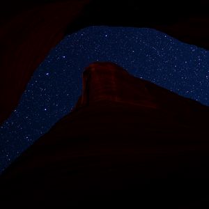 Preview wallpaper mountain, rock, starry sky, night, dark, darkness