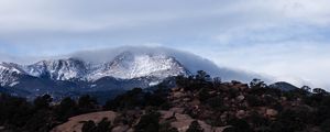 Preview wallpaper mountain, rock, stones, trees, clouds, nature