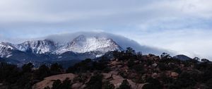 Preview wallpaper mountain, rock, stones, trees, clouds, nature