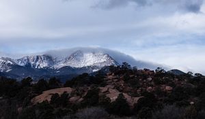 Preview wallpaper mountain, rock, stones, trees, clouds, nature