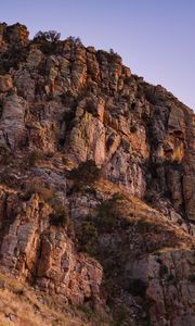 Preview wallpaper mountain, rock, stones, grass, dry, nature