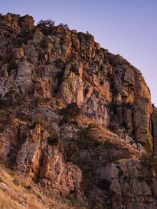 Preview wallpaper mountain, rock, stones, grass, dry, nature