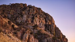 Preview wallpaper mountain, rock, stones, grass, dry, nature