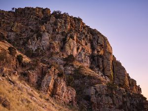 Preview wallpaper mountain, rock, stones, grass, dry, nature