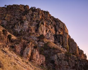 Preview wallpaper mountain, rock, stones, grass, dry, nature