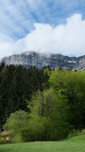 Preview wallpaper mountain, rock, trees, clouds, landscape, nature