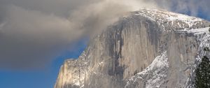 Preview wallpaper mountain, rock, trees, snow, clouds