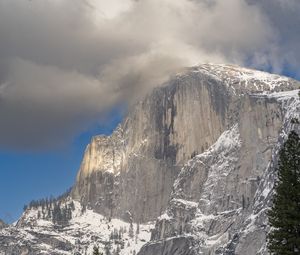 Preview wallpaper mountain, rock, trees, snow, clouds