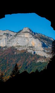 Preview wallpaper mountain, rocks, peak, cave, trees