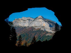 Preview wallpaper mountain, rocks, peak, cave, trees