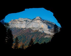 Preview wallpaper mountain, rocks, peak, cave, trees
