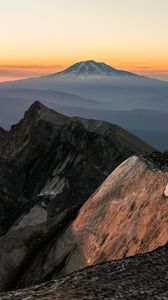 Preview wallpaper mountain, rocks, sunrise, fog