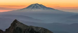 Preview wallpaper mountain, rocks, sunrise, fog