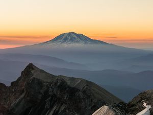 Preview wallpaper mountain, rocks, sunrise, fog