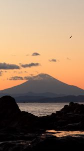 Preview wallpaper mountain, sea, stones, twilight, nature