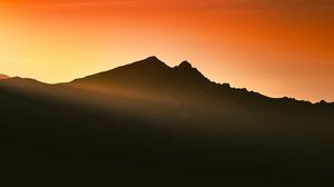 Preview wallpaper mountain, silhouette, sunset, sunlight, dusk