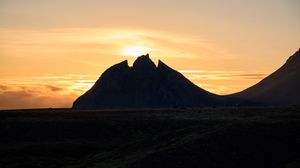 Preview wallpaper mountain, silhouette, valley, sunset