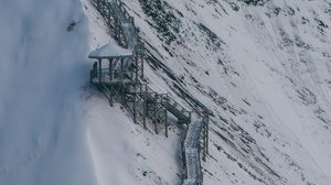 Preview wallpaper mountain, slope, buildings, snow, winter