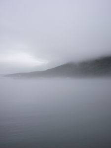 Preview wallpaper mountain, slope, fog, sea, nature